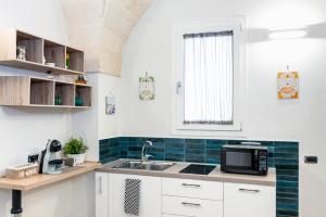 Η κουζίνα ή μικρή κουζίνα στο La Pala Suite Apartment