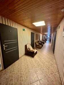 a hallway with couches and chairs in a building at Zajazd Restauracja Derby in Błonie