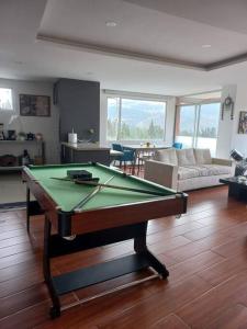 a living room with a pool table in it at Departamento con jacuzzi 5 piso Condado 2 habitaciones in Quito