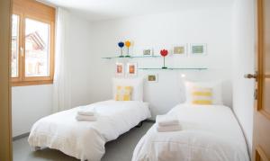 Katil atau katil-katil dalam bilik di Holiday apartment La Costa Valbella- Lenzerheide