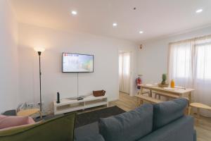a living room with a couch and a table at Best Houses 102 - Hut Spot Peniche in Peniche