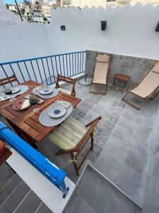 an overhead view of a table and chairs on a balcony at Casa Blue in Torrox