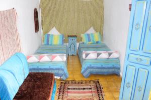 Una cama o camas en una habitación de Casa Mablu