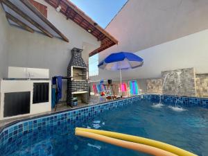 Swimmingpoolen hos eller tæt på Casa de Praia do Dema com Piscina prox Praia