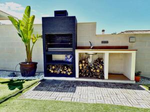 a fire place in the side of a house at Villa Las Niñas Costa del Sol in Mijas