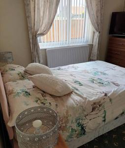 a bedroom with a bed with a window and a basket at Bungalow in Shildon County Durham in Shildon