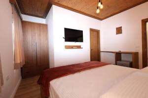 מיטה או מיטות בחדר ב-Bujtina Liana Hotel