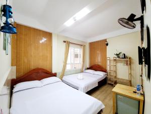 Postel nebo postele na pokoji v ubytování Bình Đào Hotel - Khách sạn ngay trung tâm giá rẻ