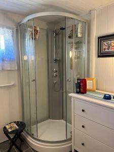 a shower with a glass door in a bathroom at 4 Person Holiday Home Sletta 