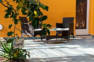 a dining room with chairs and a table at La Casa di Bianca in Follonica