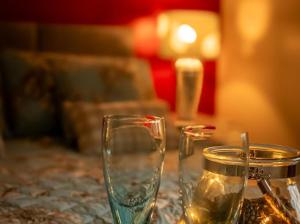 two glasses are sitting on a table with water at The Gardens B&B in Birr