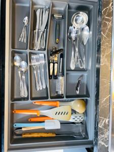 a drawer full of kitchen utensils in a refrigerator at The Samantha Guest House in Santo Stefano di Magra