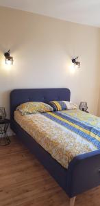 a bed in a bedroom with two pillows on it at Villa Mas Fa Susa 3 étoiles avec piscine in Les Vans +13 photos