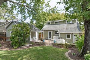 an exterior view of a house with a yard at Firefly Cottage - close to beach & town! in South Haven