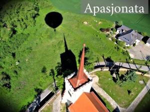 an aerial view of a church with a hot air balloon at Apasjonata in Świdnica
