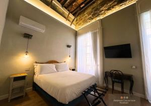 Postel nebo postele na pokoji v ubytování Heritage Collection Palermo B&B