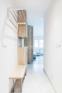 a room with a wooden bench in a room at Apartment in Boyana in Sofia