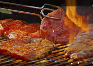 a group of meat andoni cooking on a grill at Stella Maris Holidays in Maiori