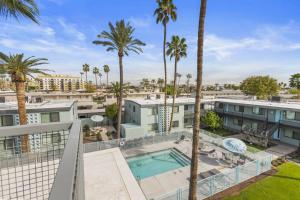 an apartment with a swimming pool and palm trees at Intimate well appointed Studio w Pool in Scottsdale