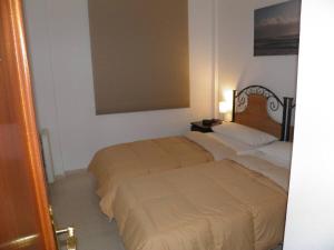Ένα ή περισσότερα κρεβάτια σε δωμάτιο στο Apartamento Los Pescadores