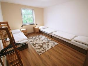 Llit o llits en una habitació de Palenčareň - Old Destilery
