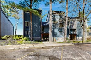 an empty parking lot in front of a house at Tall Timber B-2 in Glen Arbor