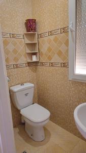 a bathroom with a toilet and a sink at Bensassi Urban Escape in La Marsa