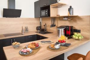 a kitchen with a counter with some food on it at Apartment Mama Marija in Hvar