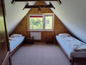 Postel nebo postele na pokoji v ubytování Podołynia