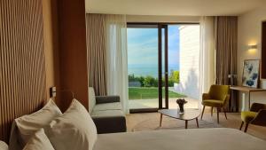 Postel nebo postele na pokoji v ubytování Sól by Privé - Boutique Hotel - Kepi i Rodonit