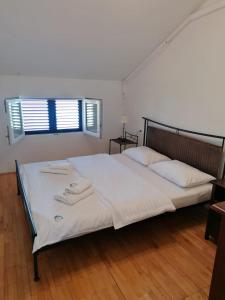 Posteľ alebo postele v izbe v ubytovaní Apartments Villa Julia