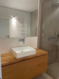 a bathroom with a white sink and a shower at JustlikeHome - Prime Selection II - Loft in Bochum