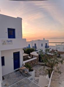 a view of a building with a sunset at Hyades - Downtown Suites, Mykonos Town in Mýkonos City