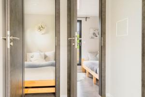 a door leading into a bedroom with a bed at Cozy Houseboat in Zwartsluis in Zwartsluis