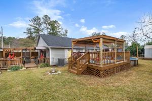 a large gazebo in the backyard of a house at Boho Indian Oasis: 3bd - Pool - Tranquil Retreat in Tallahassee