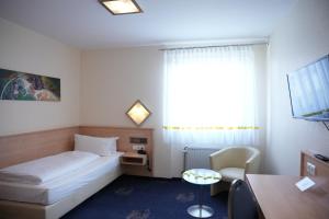 Postel nebo postele na pokoji v ubytování Weber Hotel Mannheim + 37 fotografií