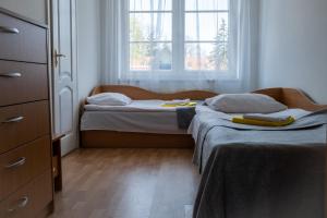 Ένα ή περισσότερα κρεβάτια σε δωμάτιο στο Palangos Ramybės apartamentai