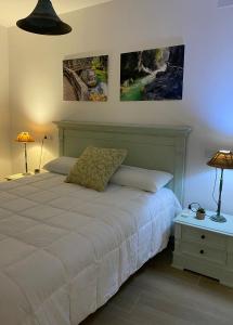 Postel nebo postele na pokoji v ubytování Habitaciones con baño sin cocina ni salón Sierra de las Villas