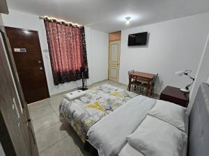 Postel nebo postele na pokoji v ubytování Hospedaje Las Parraz