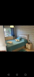 En eller flere senge i et værelse på Burriana Edf Haway