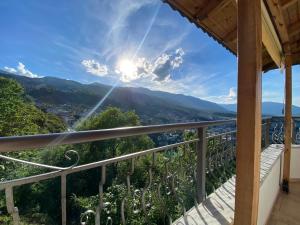a balcony with a view of the mountains at Guest House Persa in Gjirokastër