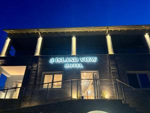a building with a sign that reads island view hotel at 3 Island View Hotel in Nydri