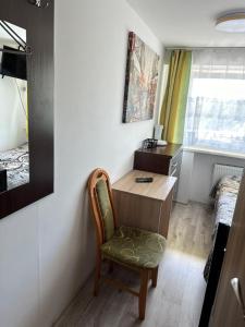Uma TV ou centro de entretenimento em Pokoje i apartamenty Aga Centrum