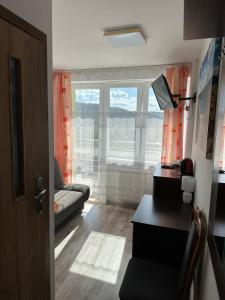Uma área de estar em Pokoje i apartamenty Aga Centrum