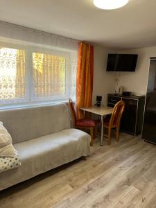 Uma área de estar em Pokoje i apartamenty Aga Centrum