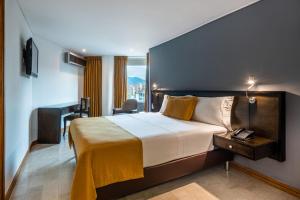 Postel nebo postele na pokoji v ubytování Hotel Egina Medellin