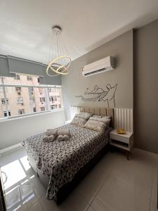 Postel nebo postele na pokoji v ubytování Paraíso de Férias - Flats Copacabana