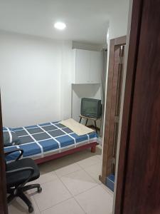 Säng eller sängar i ett rum på Brisas del Rio Norte