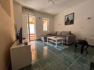 a living room with a couch and a table at GRAMISI apartments in Kruče +27 photos