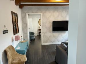 TV a/nebo společenská místnost v ubytování Traumwohnung mit eigenem Spa